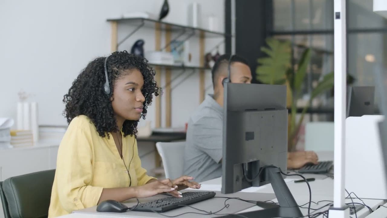 Contact center agents working alongside AI voice and digital agents for customer-service resolution